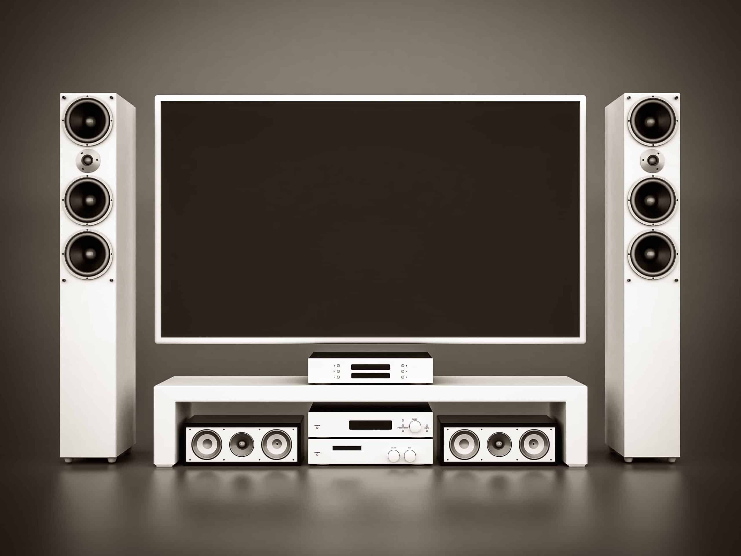 Sound bar mounted below a wall mounted TV in a living room