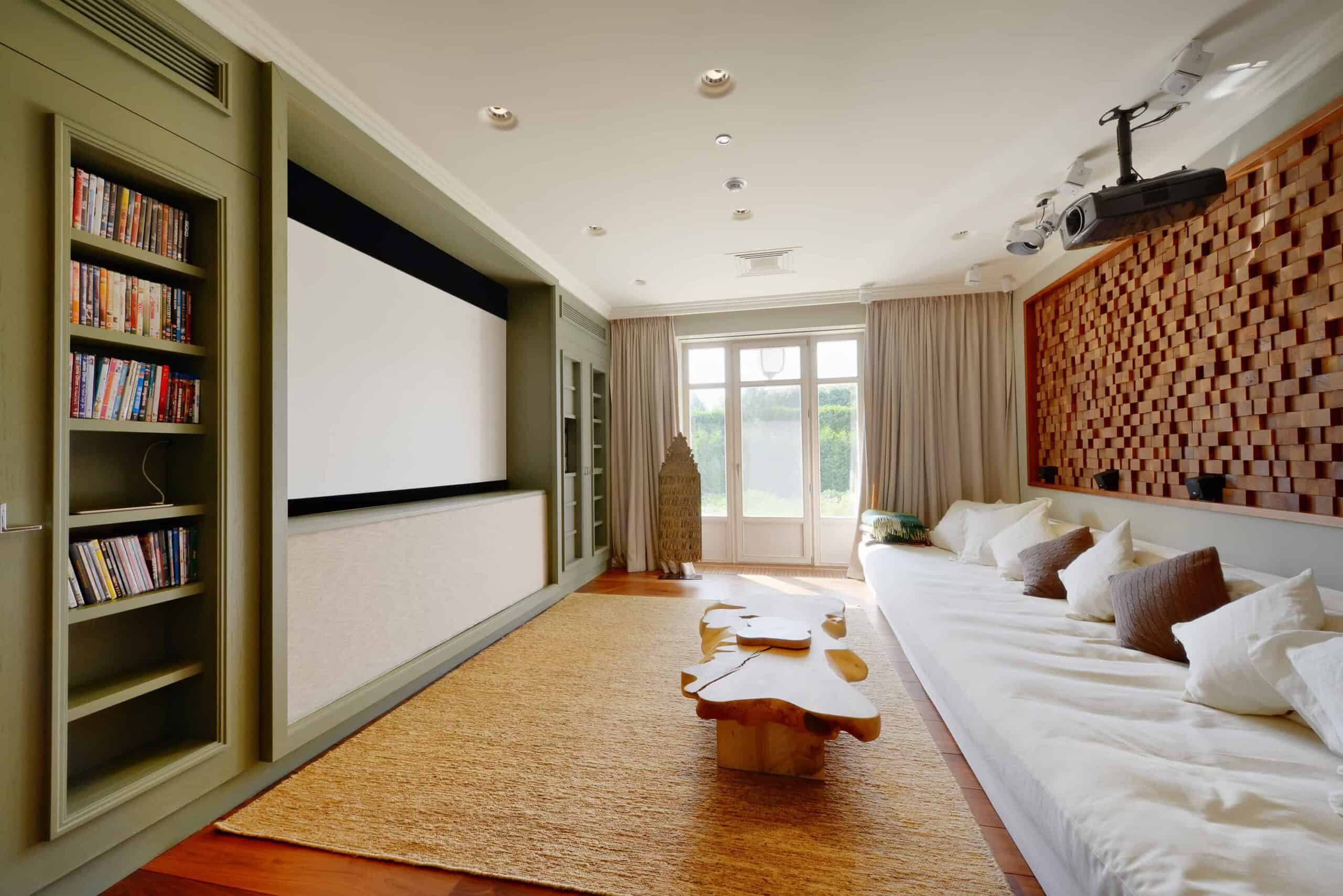 Floating sound bar mounted below a wall mounted TV